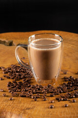 Glass cup, glass cup with milk and coffee on rustic wood, selective focus.