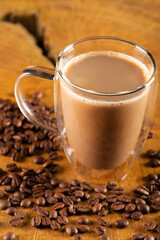 Glass cup, glass cup with milk and coffee on rustic wood, selective focus.