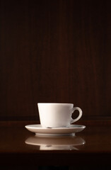 White mug on wooden tablewhite cup on wooden table: vertical image