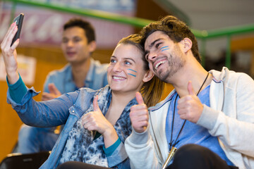 portrait of supporters doing a selfie