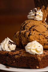 Macro shot of a wonderful composition made of espresso coffee served on the table next to ice cream on a brownie buying now.