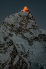 Nuptse (7861m): Last rays of light hitting the peak of this beauty. Photo taken during sunset hike to nearby peak of Kala Patthar © Michal