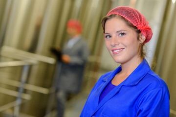 Fototapeta female factory worker smiling at camera obraz