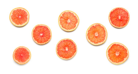 Composition with slices of ripe grapefruit on white background