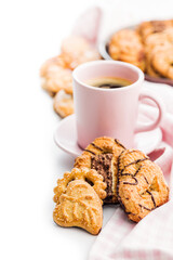 Assorted various cookies and coffee cup. Sweet biscuits isolated on white background.