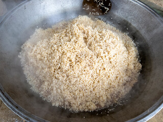 The rice from the plov has already been added to the cauldron.