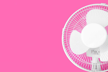 Electric fan on pink background