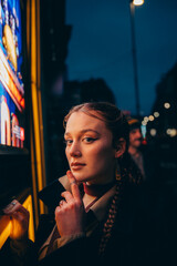  woman in a night city in colored light  © Anna