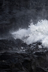 Very big waves and beautiful black rocks the power of the ocean