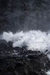 Very big waves and beautiful black rocks the power of the ocean