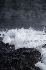 Very big waves and beautiful black rocks the power of the ocean