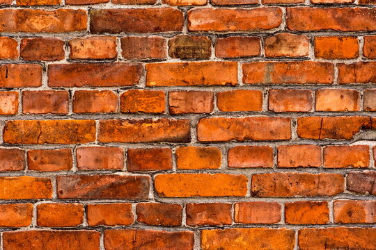 Fototapeta Ceglana ściana starego domu zbudowanego z czerwonych cegieł .