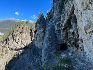 An attractive hiking trail through the rocks of the Schaftobelbach alpine canyon and to the Schaftobelfall waterfall, Alvaneu Bad (Alvagni Bogn) - Canton of Grisons, Switzerland (Schweiz)