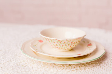 Closeup of porcelain plates and bowls