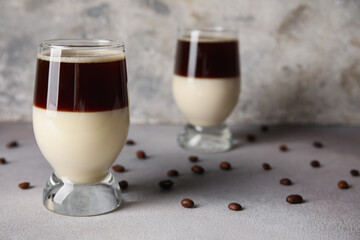 Glasses of tasty Cafe Bombon on light table