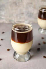 Glass of tasty Cafe Bombon on light table