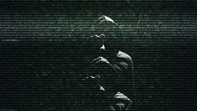 Isolated portrait of a mysterious figure in a black hoodie pointing a finger at the camera. A hacker stranger in black backlit with a digital code and a glitch effect points his finger at you. choice