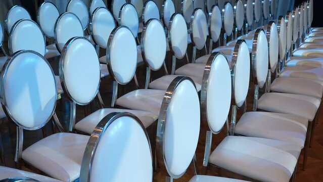 White transparent plastic Chiavari chairs in rows