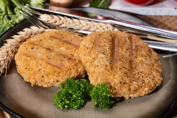 Source of fibre plant based vegan wheat protein grilled burgers, meat free healthy food close up