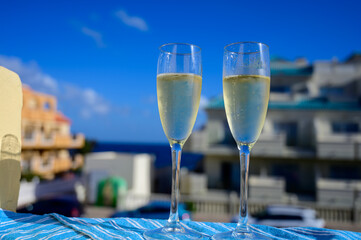 Dinner party, drinking of cava or champagne sparkling wine in vacation resort Caleta Fuste, Fuerteventura, Canary islands vacation, Spain