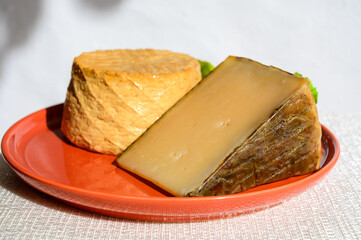 Spanish cheeses collection, pieces of smoked and old matured goat cheeses