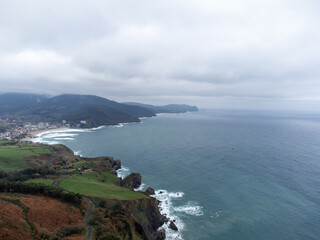 Atlantic ocean coastline near famous landmark and film location in North of Spain, ocean islet with chapel San juan de Gaztelugatxe, Basque Country, Spain in winter