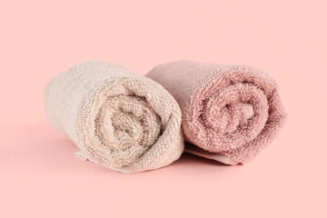 Obraz na płótnie Canvas Clean soft towels on pink background