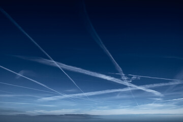 Blue Sky With Grid Of White Condensation Trails, Contrails, From Airplane