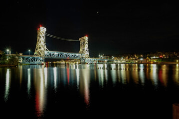 Bridge and city lights at night © Michael