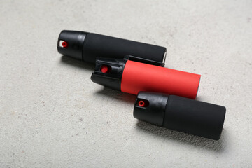 Pepper sprays on light background