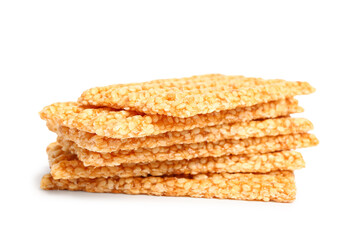 Stack of sweet sesame kozinaki on white background