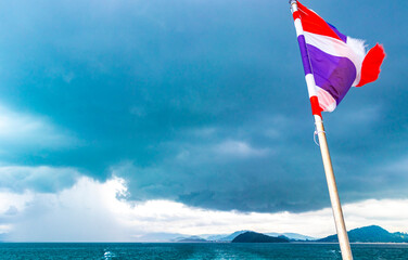 Thailand flag on boat on tour on Phuket island Thailand.