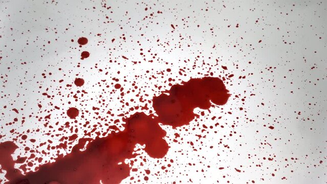 Blood dripping against white background