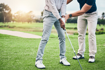 Fototapeta Golf lesson, sports teaching and coach hands helping a man with swing and stroke outdoor. Lens flare, green course and club support of a athlete ready for exercise, fitness and training for a game obraz