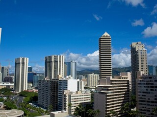 Fototapeta na wymiar High-rises loom above Waikiki, Honolulu's famed tourist district
