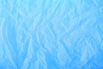 Bright blue textured paper for backgrounds, banners and web elements. Crumpled texture effect. 