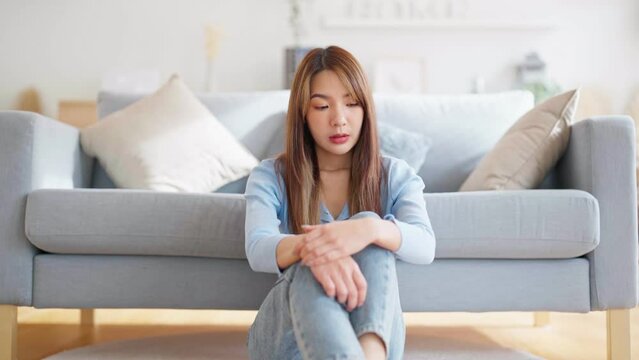 Young asian woman upset , sadness and frustrated by problem with work or relationships. Feeling despair and anxiety, loneliness, having psychological trouble