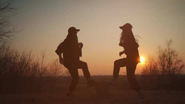 two female athlete have fitness workout and exercise on fresh open air at sunset
