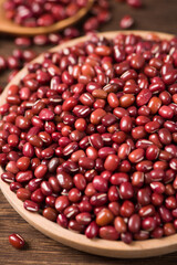 Azuki beans or red beans in wooden plate on  table