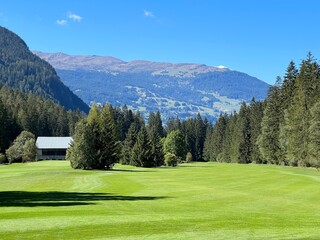 Fototapeta na wymiar Alvaneu Bad Golf Club or Golfplatz Alvaneu Bad in the beautiful alpine valley of the river Albula or Alvra - Canton of Grisons, Switzerland (Kanton Graubünden, Schweiz)