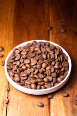 Premium Colombian Coffee Beans on Wooden Plank