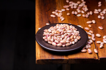 Fototapeta na wymiar Bean Grains on Wooden Background