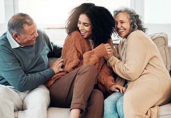 Family, playful and a black woman at her parents home for a visit while bonding on a sofa in the living room together. Love, relax and a senior father tickling his daughter while having fun - obrazy, fototapety, plakaty