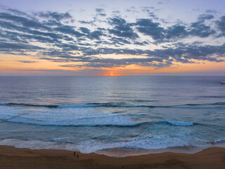 Sunrise at the seaside with clouds