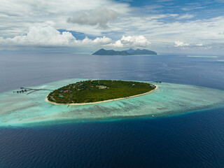 Aerial drone of island with beach and coral reef in the tropics. Pom Pom islet. Tun Sakaran Marine...