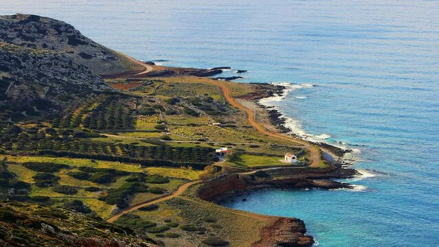 Agios Dionysios (Xepapadeas) beaches. Only beach in Mirabello area that faces purely east and is typically calm. Adjacent to Xepapadia, you can find the picturesque chapel of St. Diony. Crete, Greece