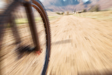 Cycling wheel, motion blur and fitness in nature, countryside and training of triathlon, sports and...