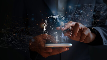 Young businessman in suit using smartphone, global big data connection concept through virtual technology analyzing economic market data to cover regions