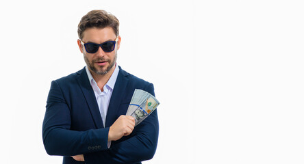 Man in suit with money cash. Dollar banknotes. Portrait of man holding american money banknotes....