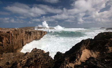 Fototapeta premium Large storm waves crashing into Laie Point coastline at Kaawa on the North Shore of Oahu Hawaii United States